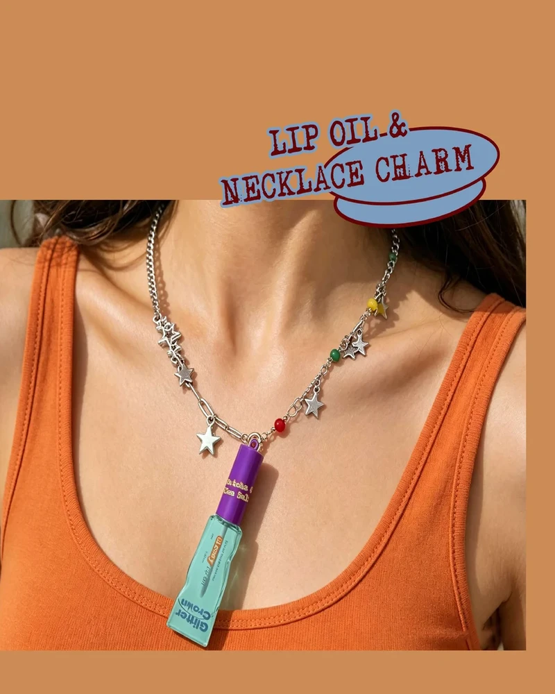 Model wearing Glossy Lip Oil necklace with celestial charms in Matcha Sea Salt